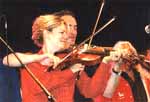 Cross fiddles by Dervish's Tom Morrow and Natalie MacMaster; photo by The Mollis